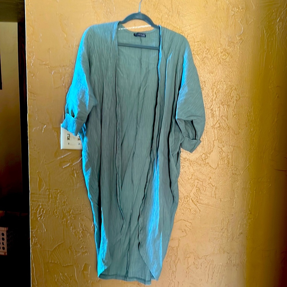 Light green cardigan that can be worn casually or dressed up.